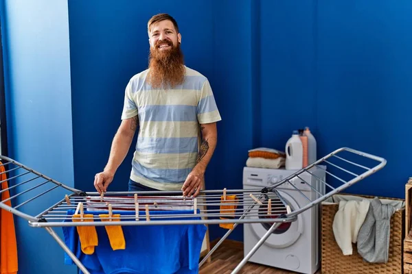 Young Redhead Man Smiling Confident Hanging Clothes Clothesline Laundry Room — ストック写真