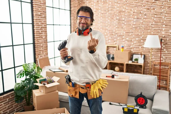 Handsome Middle Age Man Holding Screwdriver New Home Showing Middle — Stockfoto
