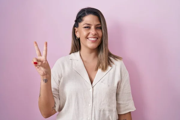 Blonde Woman Standing Pink Background Showing Pointing Fingers Number Two — Stok fotoğraf