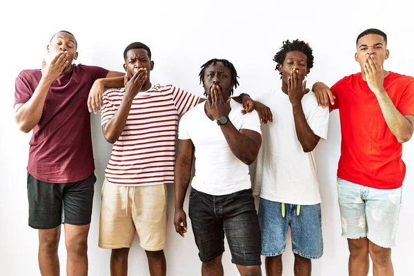 Young African Group Friends Standing Together Isolated Background Bored Yawning — Stock Photo, Image