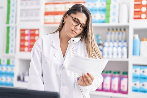 Young Hispanic Woman Pharmacist Talking Telephone Reading Prescription Pharmacy — Photo