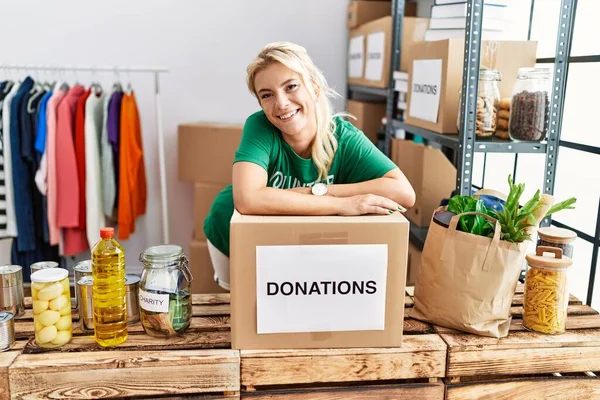 Young Blonde Volunteer Girl Smiling Happy Standing Charity Center — Stock Photo, Image