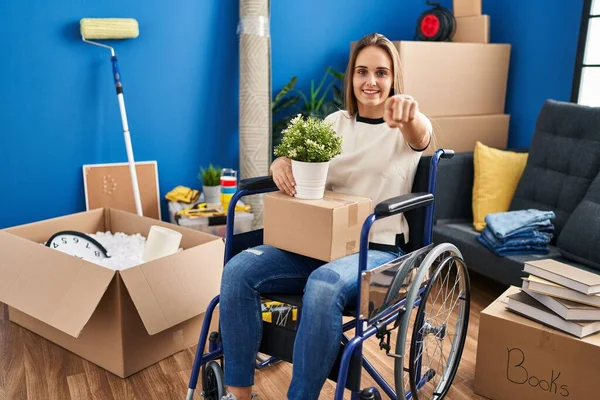 Young Woman Sitting Wheelchair Moving New Home Pointing You Camera — Stock Photo, Image