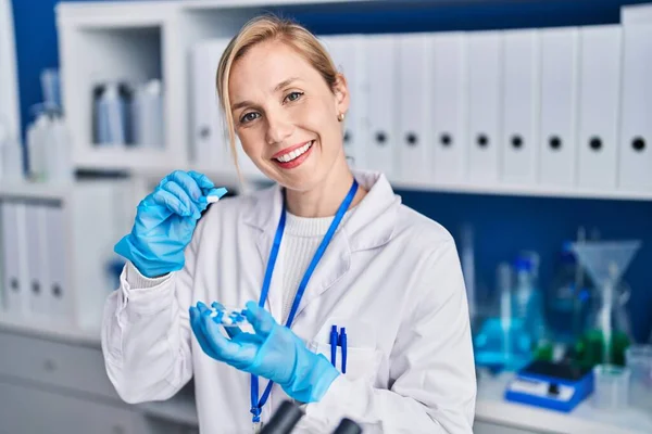 Young Blonde Woman Scientist Holding Pills Laboratory — Stock Photo, Image