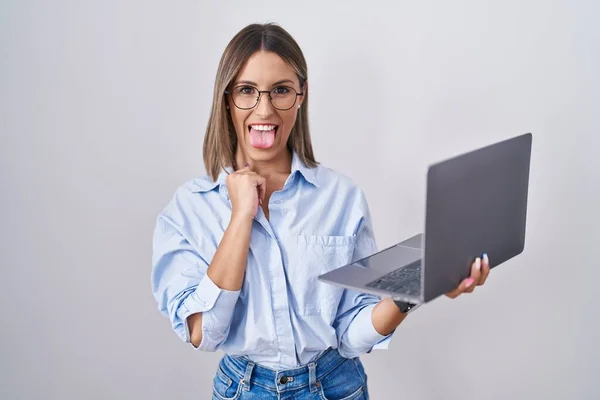 Young Woman Working Using Computer Laptop Sticking Tongue Out Happy — ストック写真