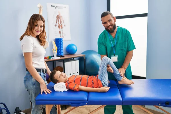 Family Having Physiotherapy Session Stretching Child Legs Rehab Clinic — Stok fotoğraf