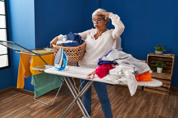 Middle Age Woman Stressed Doing Chores Laundry Room — Stockfoto