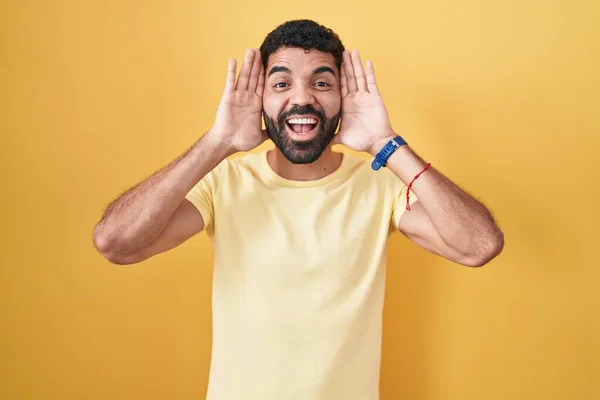 Hispanic Man Beard Standing Yellow Background Smiling Cheerful Playing Peek — Stock Photo, Image
