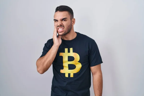 Young Hispanic Man Wearing Bitcoin Shirt Touching Mouth Hand Painful — Stock Photo, Image