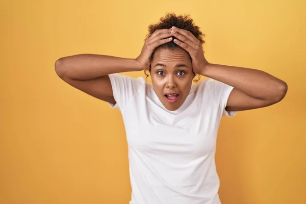 Young Hispanic Woman Curly Hair Standing Yellow Background Crazy Scared — Foto de Stock