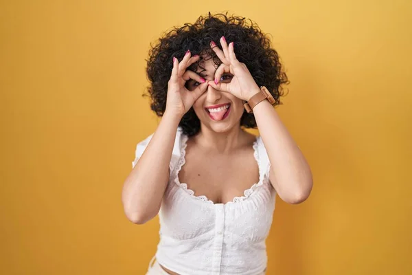 Young Brunette Woman Curly Hair Standing Yellow Background Doing Gesture — Stock Photo, Image