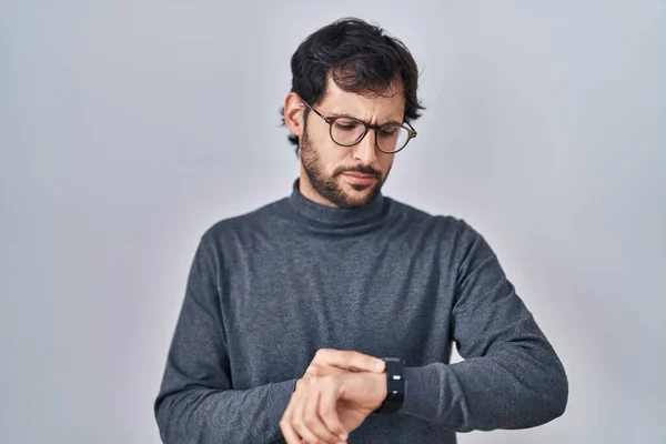 Handsome Latin Man Standing Isolated Background Checking Time Wrist Watch — Stockfoto
