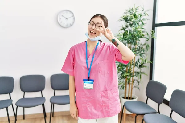 Young Asian Nurse Woman Medical Waiting Room Doing Peace Symbol — Stock Photo, Image