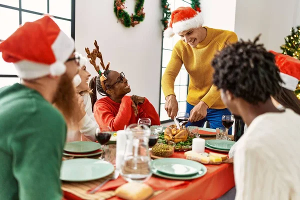 Group Young People Smiling Happy Having Christmas Dinner Man Cutting — Stock Photo, Image