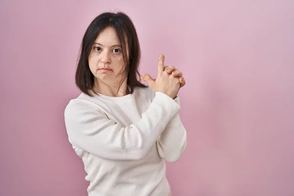 Woman Syndrome Standing Pink Background Holding Symbolic Gun Hand Gesture — Stock Photo, Image