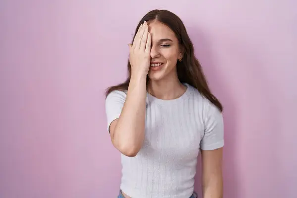 Young Hispanic Girl Standing Pink Background Covering One Eye Hand — Photo