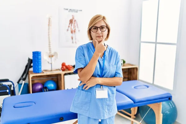 Middle Age Blonde Woman Working Pain Recovery Clinic Looking Confident — Stock Photo, Image