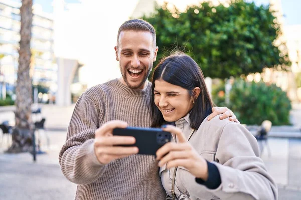 Man Woman Couple Smiling Confident Using Smartphone Street — ストック写真