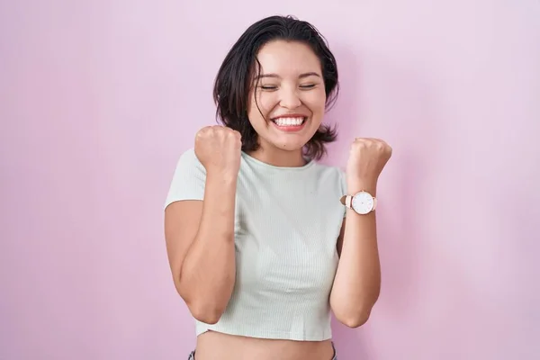 Hispanic Young Woman Standing Pink Background Excited Success Arms Raised — Zdjęcie stockowe