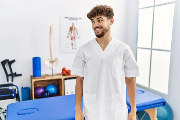 Young Arab Man Working Pain Recovery Clinic Looking Away Side — Foto de Stock