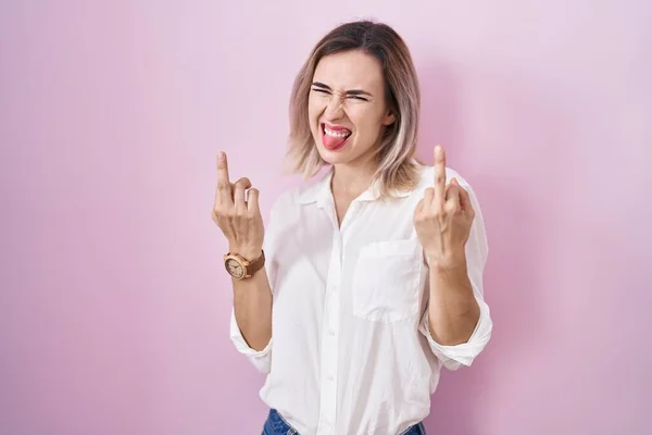Young Beautiful Woman Standing Pink Background Showing Middle Finger Doing — Stok Foto