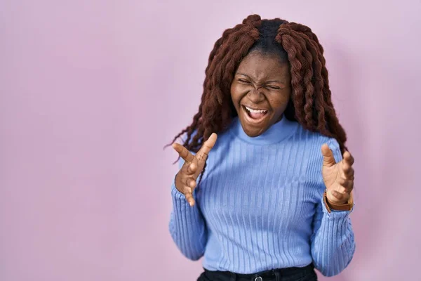 African Woman Standing Pink Background Celebrating Mad Crazy Success Arms — Stockfoto