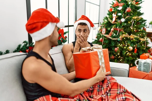Two Hispanic Men Couple Surprise Gift Sitting Christmas Tree Home — Stok fotoğraf