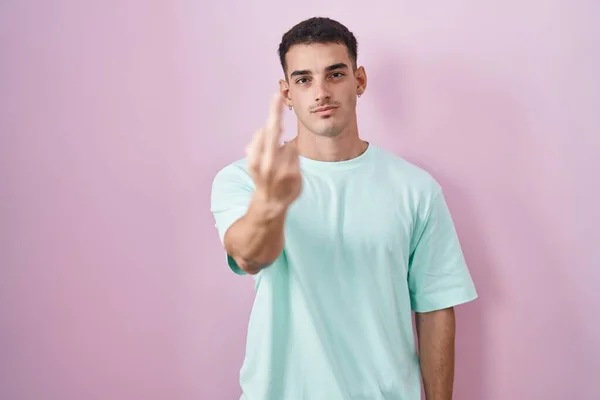 Handsome Hispanic Man Standing Pink Background Showing Middle Finger Impolite — Stockfoto