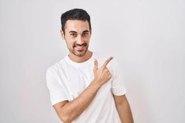 Handsome Hispanic Man Standing White Background Cheerful Smile Face Pointing — Stock Photo, Image