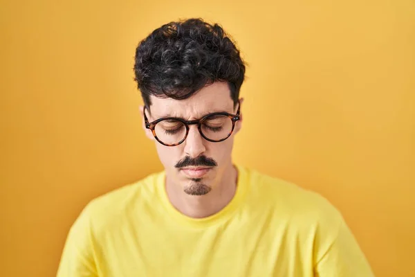 Hispanic Man Wearing Glasses Standing Yellow Background Hand Stomach Because — Stockfoto