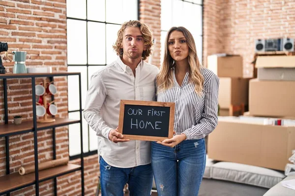 Young Couple Moving New Home Puffing Cheeks Funny Face Mouth — Stock Photo, Image