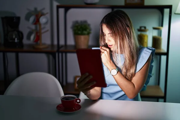Young Hispanic Woman Using Touchpad Sitting Table Night Feeling Unwell — Stockfoto