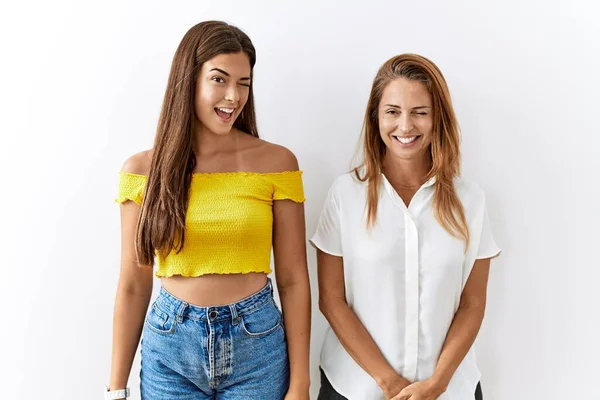 Mother Daughter Together Standing Together Isolated Background Winking Looking Camera — Stock Photo, Image