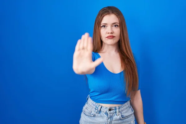 Redhead Woman Standing Blue Background Doing Stop Sing Palm Hand — Stock Photo, Image