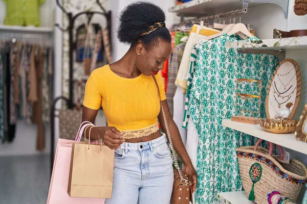 African American Woman Customer Smiling Confident Holding Handbag Clothing Store — Stok fotoğraf