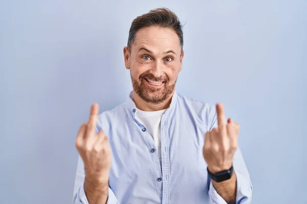 Middle Age Caucasian Man Standing Blue Background Showing Middle Finger — Stockfoto