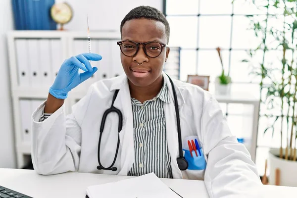 Young African Doctor Man Holding Syringe Hospital Smiling Looking Side — Stockfoto