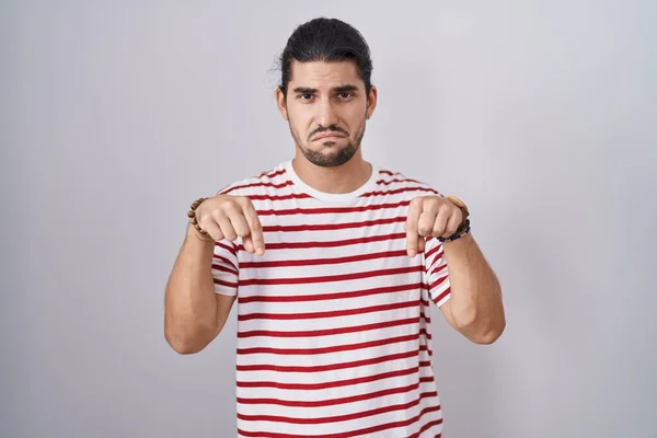 Hispanic Man Long Hair Standing Isolated Background Pointing Looking Sad — Foto de Stock