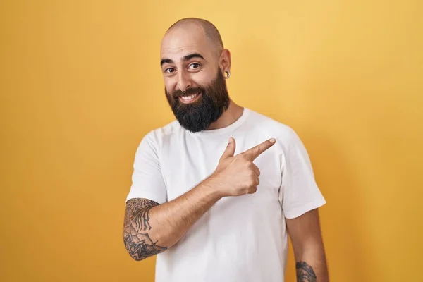 Young Hispanic Man Beard Tattoos Standing Yellow Background Cheerful Smile —  Fotos de Stock