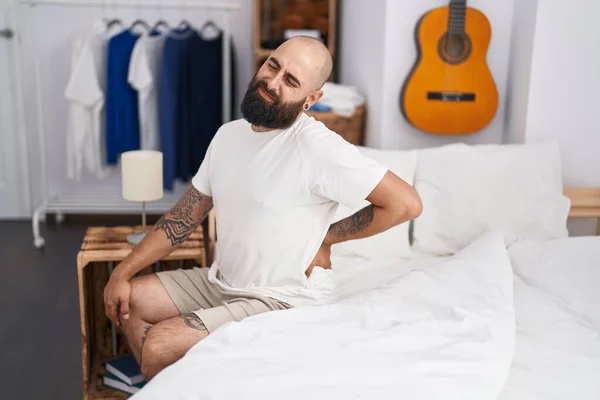 Young Bald Man Suffering Back Injury Sitting Bed Bedroom — Stock Photo, Image