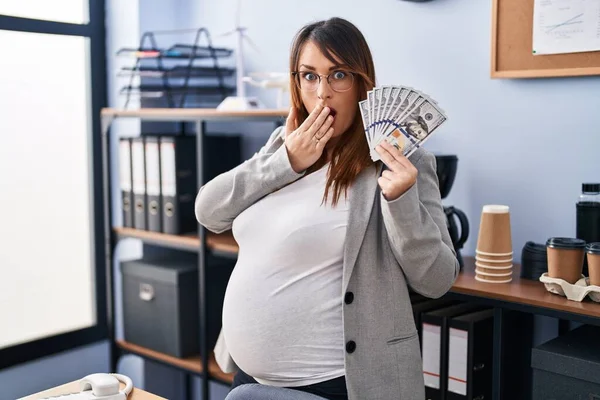 Pregnant Woman Holding Dollars Office Covering Mouth Hand Shocked Afraid — Stock fotografie