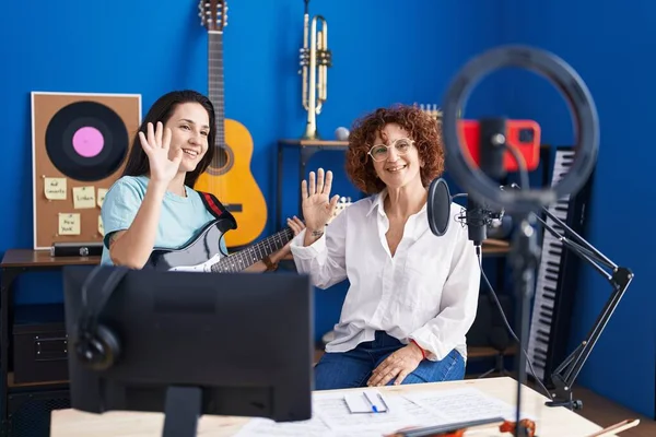 Two Women Musicians Having Online Electrical Guitar Lesson Smartphone Music — Stockfoto