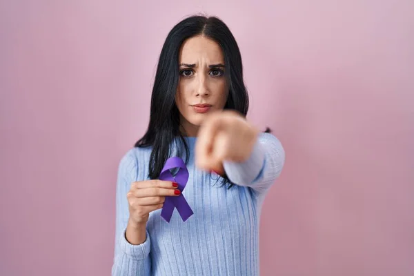 Hispanic Woman Holding Purple Ribbon Awareness Pointing Finger Camera You — Stock Photo, Image