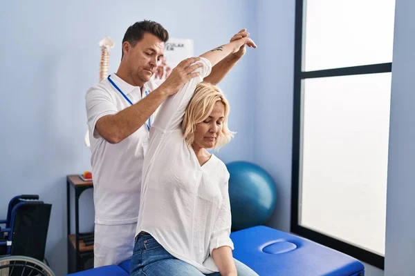 Middle Age Man Woman Physiotherapist Patient Stretching Arm Having Rehab — Stock Photo, Image
