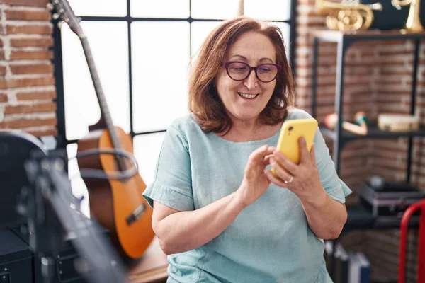 Senior Woman Musician Smiling Confident Using Smartphone Music Studio — Fotografia de Stock