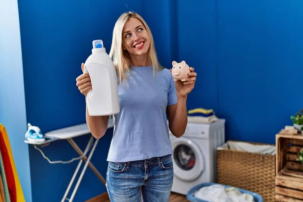 Beautiful Woman Doing Laundry Holding Detergent Bottle Piggy Bank Smiling — Stock Photo, Image