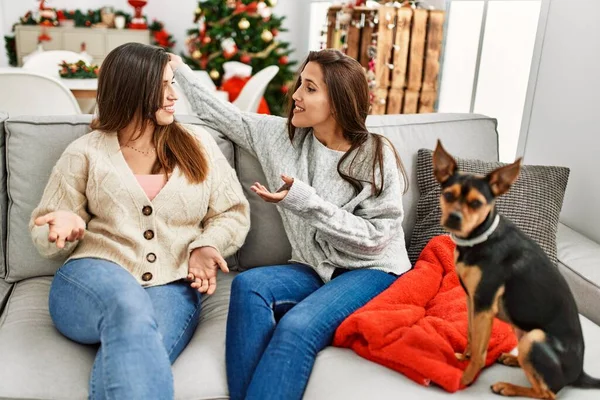 Two Women Having Conversation Sitting Dog Christmas Tree Home — Stock Photo, Image