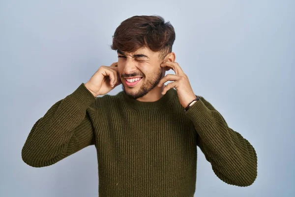 Arab Man Beard Standing Blue Background Covering Ears Fingers Annoyed — Stockfoto