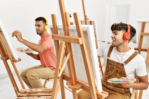 Two Hispanic Men Couple Listening Music Drawing Art Studio — Stock Photo, Image