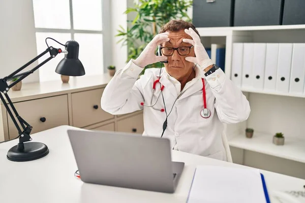 Senior Doctor Man Working Online Appointment Trying Open Eyes Fingers — Stock Photo, Image